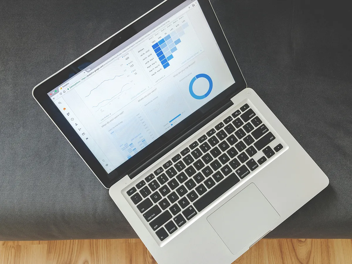 A laptop screen displaying website analytics for monitoring website traffic to increase keyword visibility.